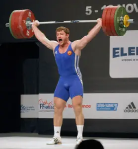 Man performing an Olympic Snatch