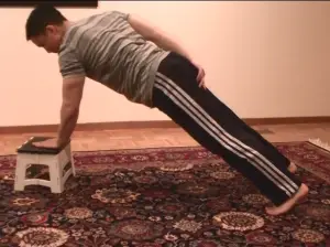 Low Incline One-Armed Pushup