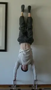 The Wall Handstand Push-up - Tutorials and Progressions - Roam Strong