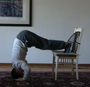 Wall supported handstand pushups - The Body Dojo