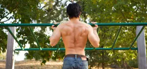 Guy Doing Pullups in Park